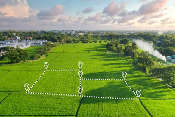 Land plot in aerial view. Identify registration symbol of vacant area for map. That property, real estate for business of home, house or residential i.e. construction, development, sale, rent and buy.